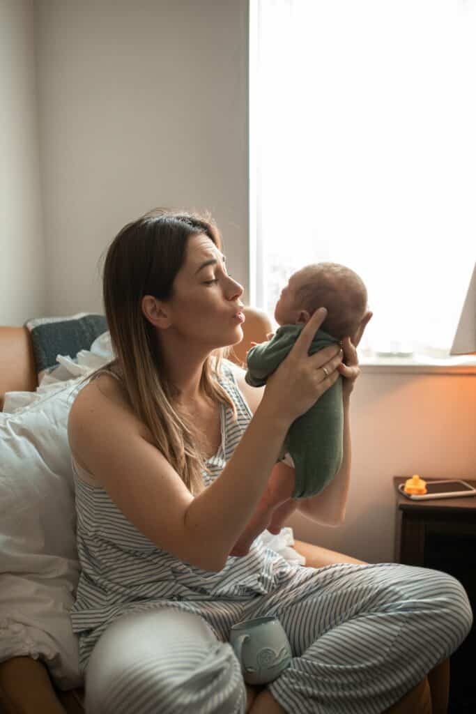 Woman holding baby up