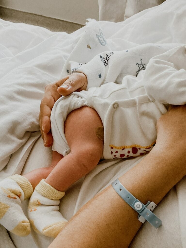 Image of woman holding newborn