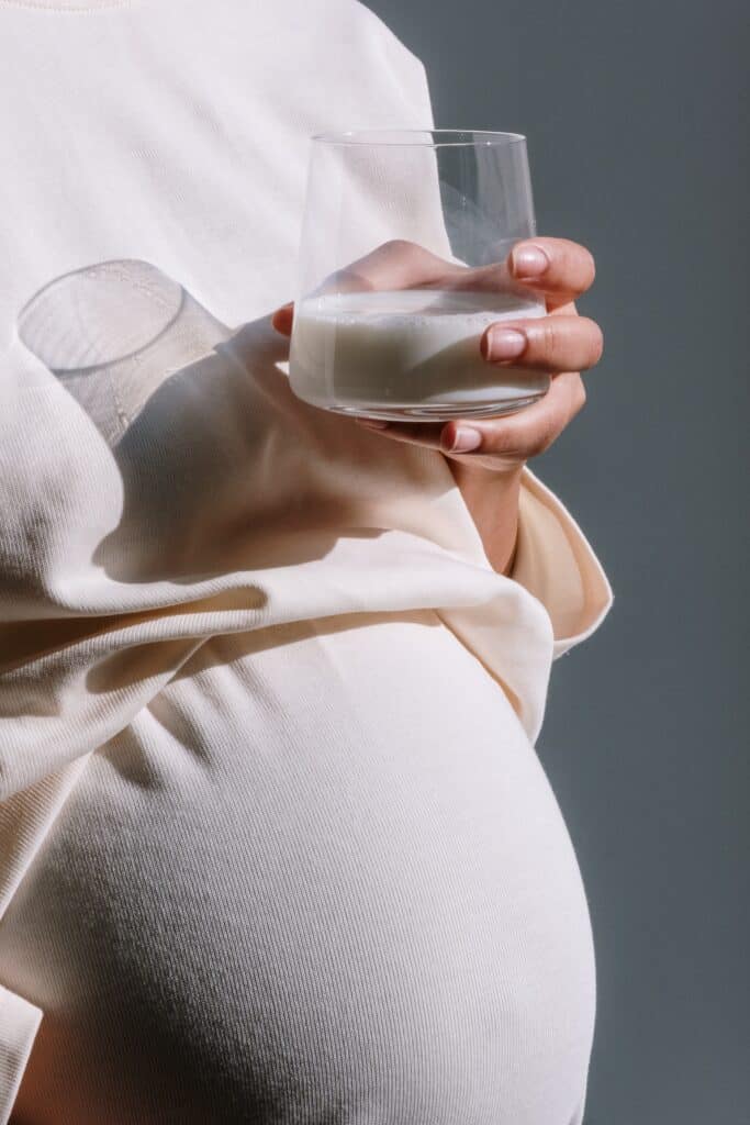 Pregnancy woman holding a glass of milk