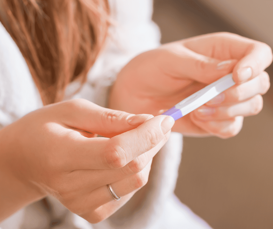 Preparing for pregnancy Woman looking at pregnancy test