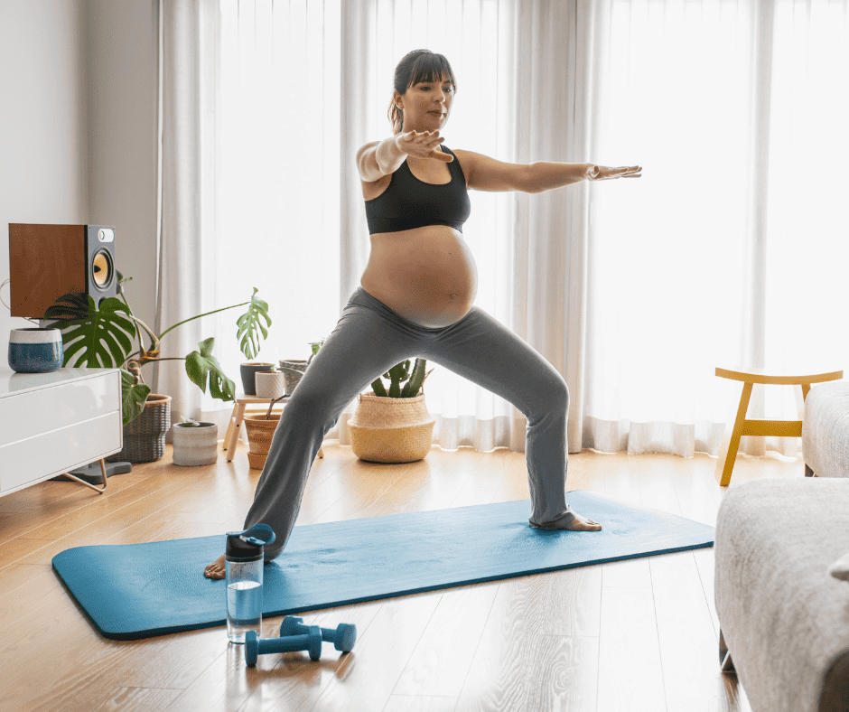 Pregnant woman doing a sumo squat 