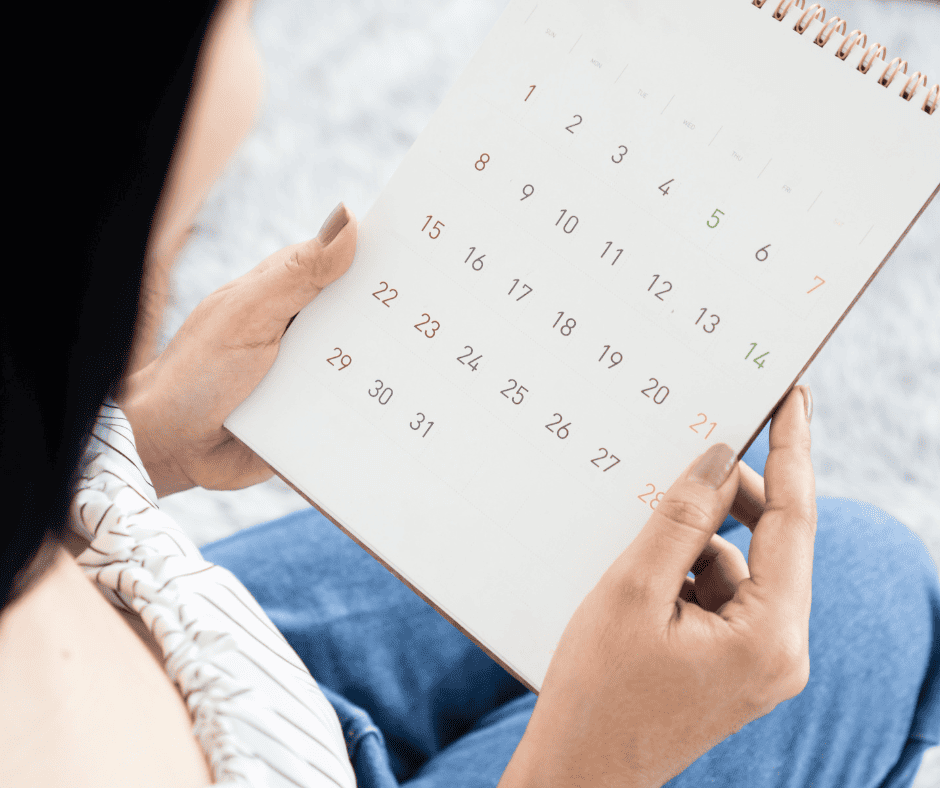 Woman looking at calendar 