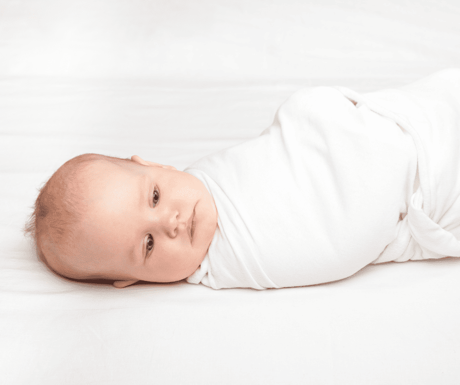 Baby in white swaddle