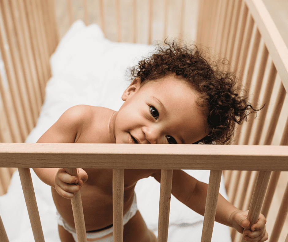 Baby standing in crib