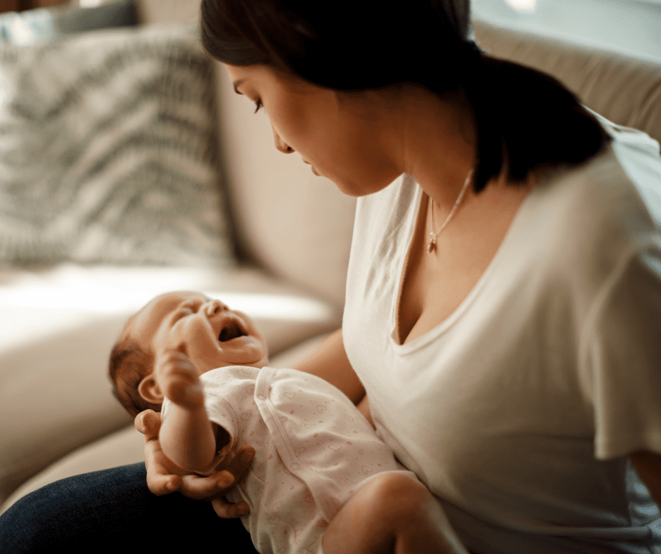 Woman holding crying baby