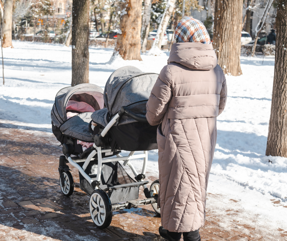 Mother walking with stroller