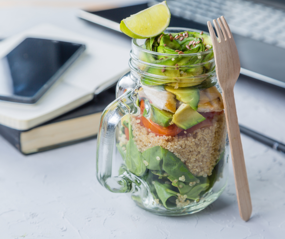 Glass jar with salad on a desk